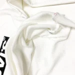Levi’s Women's Relaxed Fit Graphic Raw Cut Hem Sweatshirt In White - Image 7